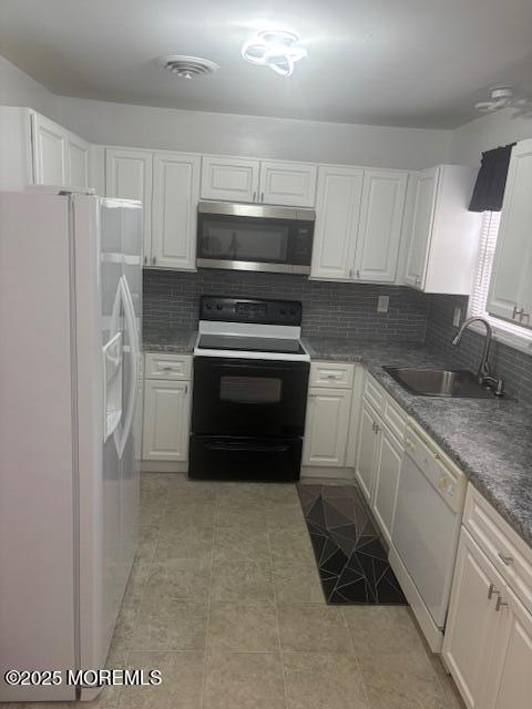 6 Ardmore St Unit A, Whiting, NJ 08759 - kitchen featuring white appliances, a sink, white cabinets, and backsplash
