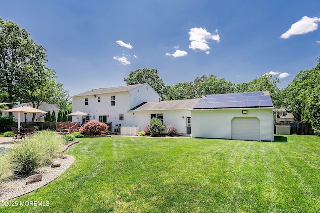5 Persimmon Dr, Jackson, NJ 08527 - rear view of property featuring an attached garage and roof mounted solar panels