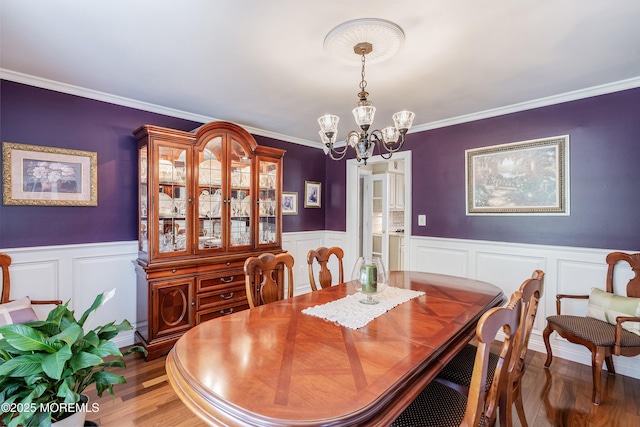 5 Persimmon Dr, Jackson, NJ 08527 - dining area with a chandelier, wainscoting, crown molding, wood finished floors, and a decorative wall
