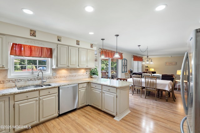 5 Persimmon Dr, Jackson, NJ 08527 - kitchen featuring appliances with stainless steel finishes, a sink, a peninsula, healthy amount of natural light, and recessed lighting