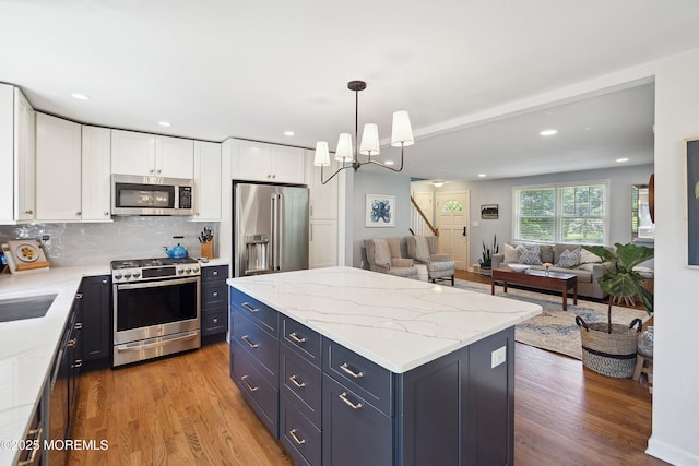 177 Cambridge Ave, Fair Haven, NJ 07704 - kitchen featuring stainless steel appliances, wood finished floors, white cabinets, and recessed lighting