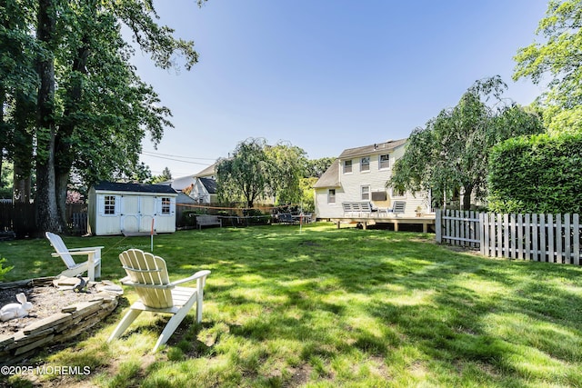 177 Cambridge Ave, Fair Haven, NJ 07704 - fenced backyard featuring a shed and a fire pit