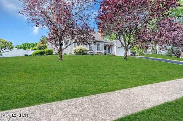 1304 Lenape Trl, Manasquan, NJ 08736 - view of front facade with an attached garage and asphalt driveway
