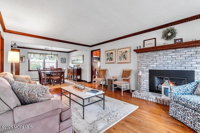 1304 Lenape Trl, Manasquan, NJ 08736 - living area featuring wood finished floors, crown molding, and a brick fireplace