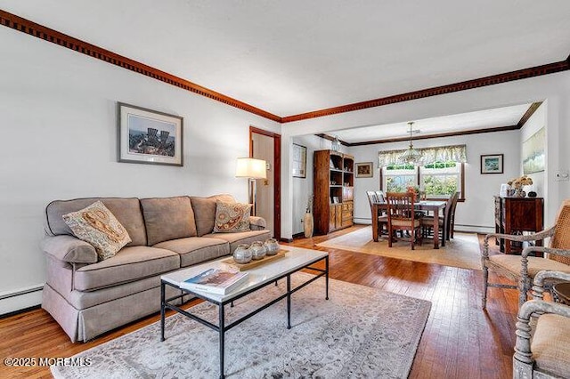 1304 Lenape Trl, Manasquan, NJ 08736 - living area featuring ornamental molding, hardwood / wood-style floors, baseboard heating, a baseboard heating unit, and baseboards
