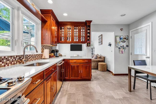 1304 Lenape Trl, Manasquan, NJ 08736 - kitchen featuring a sink, stainless steel dishwasher, light countertops, decorative backsplash, and recessed lighting