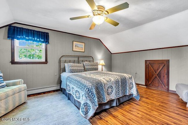 1304 Lenape Trl, Manasquan, NJ 08736 - bedroom featuring baseboard heating, vaulted ceiling, wood finished floors, and ceiling fan