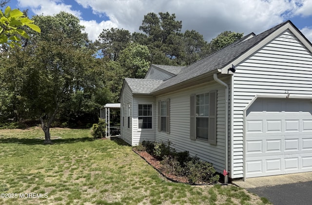 2 Cottage Ct Unit A, Whiting, NJ 08759 - view of property exterior with an attached garage, a shingled roof, and a yard
