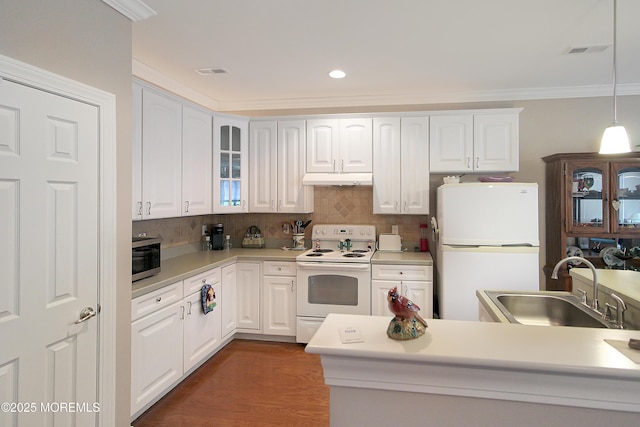 7 John Adams Ct, Whiting, NJ 08759 - kitchen featuring white appliances, a sink, white cabinetry, decorative backsplash, and ornamental molding