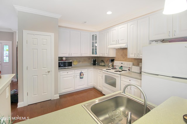 7 John Adams Ct, Whiting, NJ 08759 - kitchen with white appliances, a sink, dark wood-style flooring, ornamental molding, and under cabinet range hood