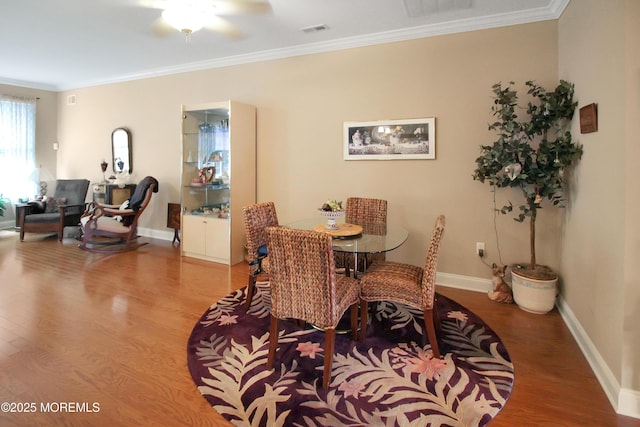 7 John Adams Ct, Whiting, NJ 08759 - dining space featuring wood finished floors, crown molding, baseboards, and ceiling fan