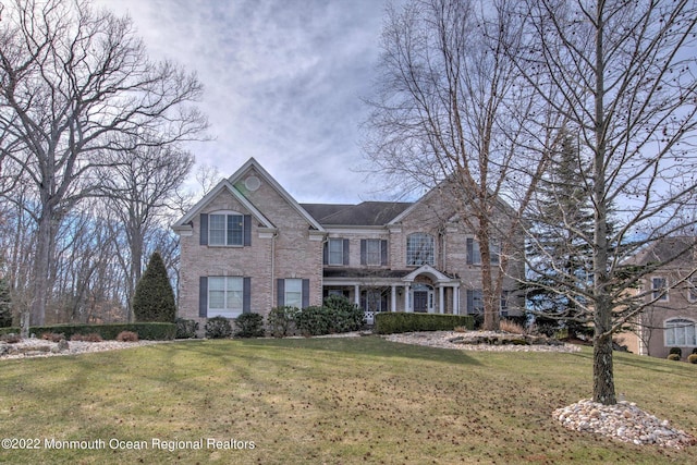 11 Elkridge Way, Manalapan, NJ 07726 - traditional home with brick siding and a front lawn