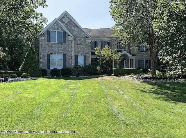 11 Elkridge Way, Manalapan, NJ 07726 - view of front of property featuring a front lawn and brick siding
