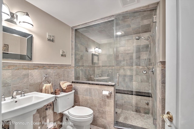 11 Elkridge Way, Manalapan, NJ 07726 - full bath with toilet, a stall shower, tile walls, and a sink