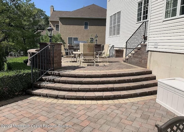 11 Elkridge Way, Manalapan, NJ 07726 - view of patio / terrace with outdoor dining space and stairs