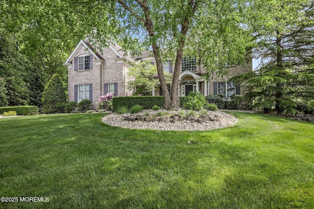 11 Elkridge Way, Manalapan, NJ 07726 - view of front of property featuring a front yard and brick siding