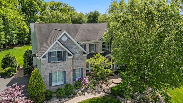 11 Elkridge Way, Manalapan, NJ 07726 - view of front of property featuring brick siding and a chimney