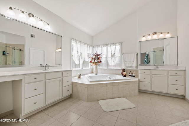 11 Elkridge Way, Manalapan, NJ 07726 - full bathroom with a shower stall, tile patterned floors, two vanities, and vaulted ceiling