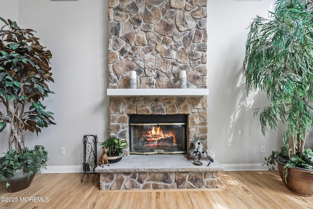 11 Elkridge Way, Manalapan, NJ 07726 - detailed view of baseboards, a fireplace, and wood finished floors