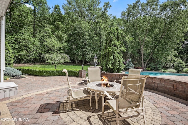 11 Elkridge Way, Manalapan, NJ 07726 - view of patio / terrace with a fire pit and an outdoor pool