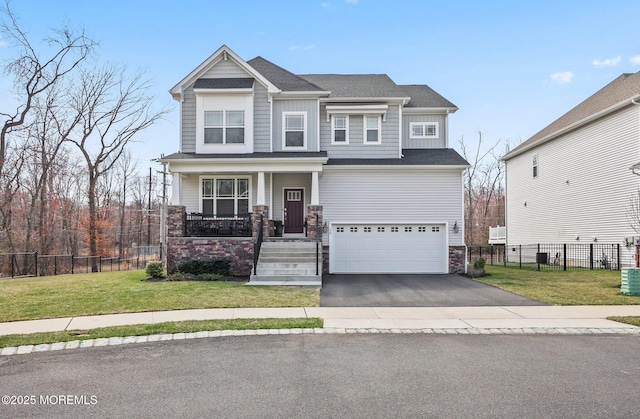 30 Heliport Dr, Tinton Falls, NJ 07724 - craftsman inspired home featuring an attached garage, a porch, stone siding, and driveway
