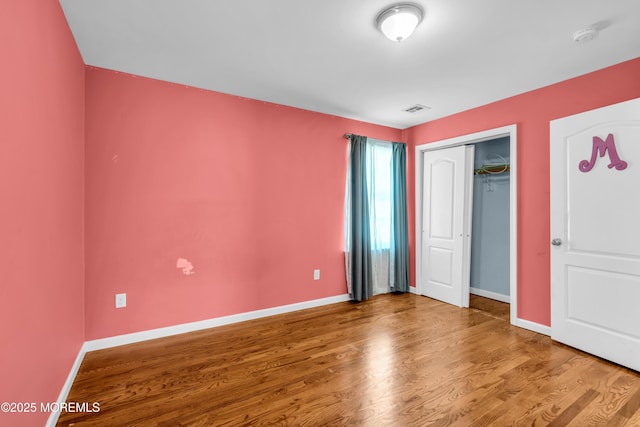 9 Fullerton Dr, Brick, NJ 08723 - unfurnished bedroom featuring wood finished floors, baseboards, and a closet
