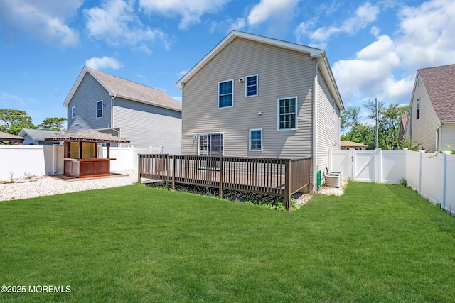 9 Fullerton Dr, Brick, NJ 08723 - rear view of property featuring a wooden deck, a gate, a jacuzzi, and central AC unit