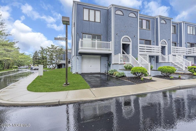 3 Black Pine Ln, Brielle, NJ 08730 - multi unit property with asphalt driveway, an attached garage, and a water view