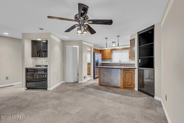 3 Black Pine Ln, Brielle, NJ 08730 - kitchen with stainless steel fridge, a sink, baseboards, and recessed lighting