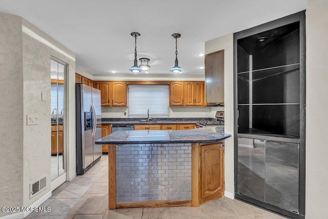 3 Black Pine Ln, Brielle, NJ 08730 - kitchen featuring stainless steel appliances, a peninsula, decorative light fixtures, a sink, and plenty of natural light