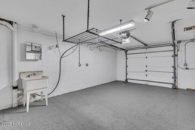3 Black Pine Ln, Brielle, NJ 08730 - garage with a garage door opener and concrete block wall