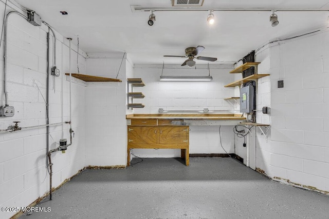 3 Black Pine Ln, Brielle, NJ 08730 - garage featuring a workshop area, concrete block wall, electric panel, and a ceiling fan