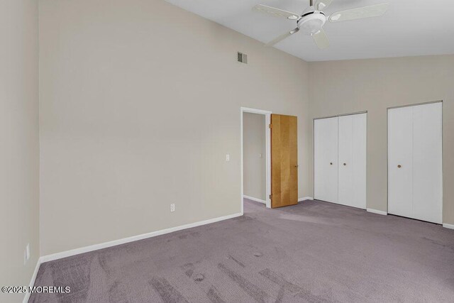 3 Black Pine Ln, Brielle, NJ 08730 - unfurnished bedroom featuring carpet, baseboards, multiple closets, high vaulted ceiling, and a ceiling fan