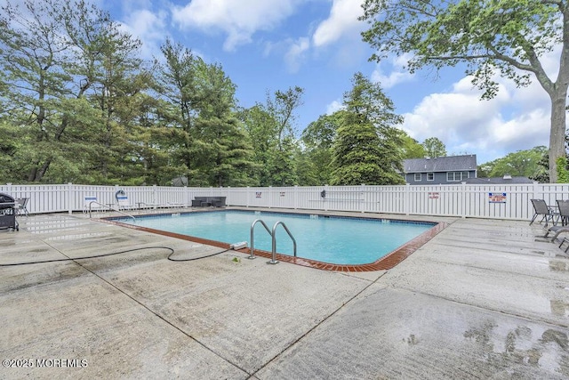 3 Black Pine Ln, Brielle, NJ 08730 - community pool featuring a patio area and view of scattered trees