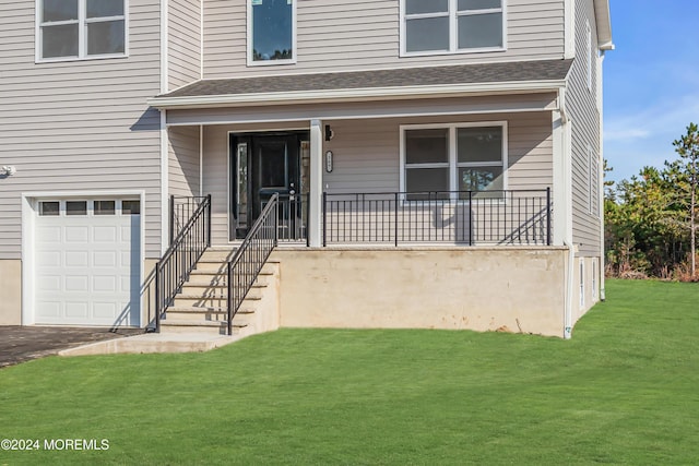 169 Grand Central Pkwy, Bayville, NJ 08721 - view of front facade with a garage, a front yard, a porch, and asphalt driveway