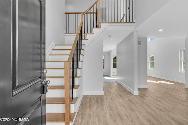 169 Grand Central Pkwy, Bayville, NJ 08721 - entryway featuring wood finished floors, stairway, baseboards, a high ceiling, and recessed lighting