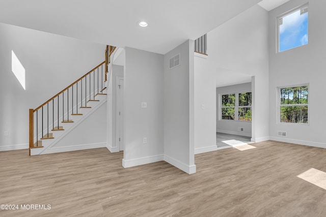 169 Grand Central Pkwy, Bayville, NJ 08721 - unfurnished living room featuring light wood-style floors, stairway, baseboards, and recessed lighting