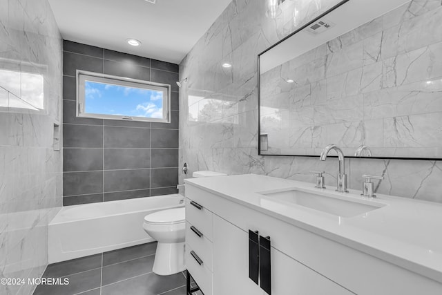 169 Grand Central Pkwy, Bayville, NJ 08721 - full bathroom featuring tile walls, toilet, vanity, tile patterned flooring, and shower / bath combination