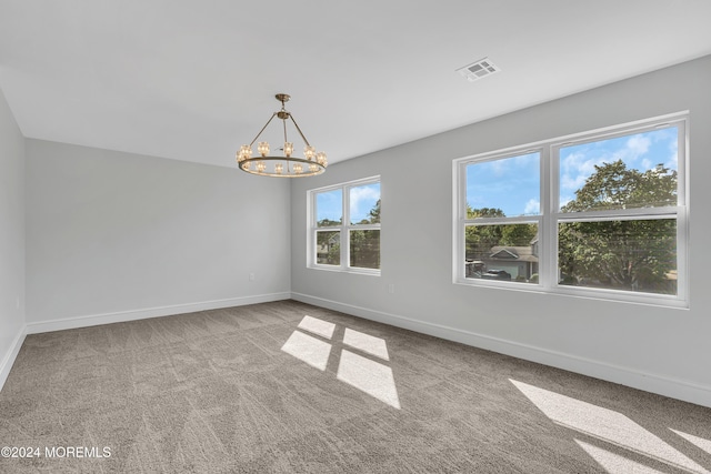 169 Grand Central Pkwy, Bayville, NJ 08721 - carpeted empty room with a chandelier and baseboards