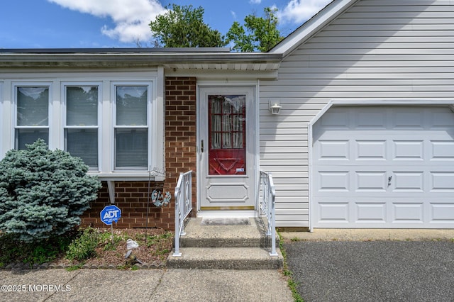 1A Winthrop Pl Unit 55, Whiting, NJ 08759 - entrance to property with brick siding and an attached garage