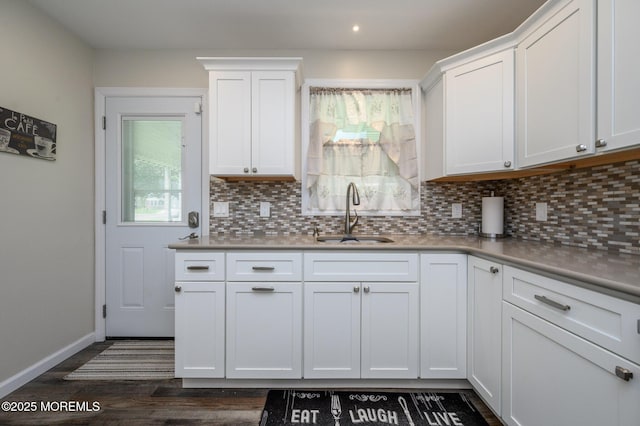 1A Winthrop Pl Unit 55, Whiting, NJ 08759 - kitchen with a sink, tasteful backsplash, white cabinets, dark wood-style flooring, and recessed lighting