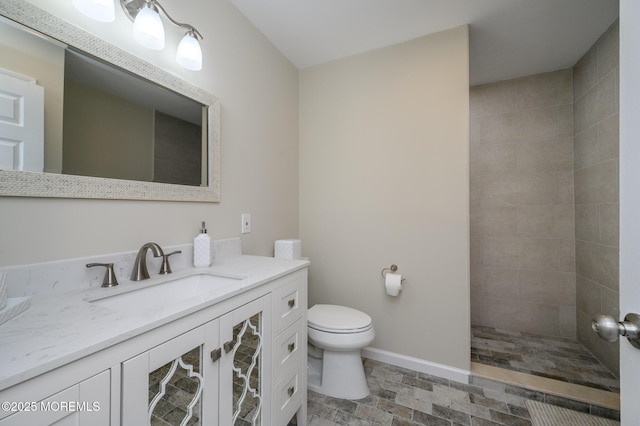 1A Winthrop Pl Unit 55, Whiting, NJ 08759 - bathroom featuring vanity, toilet, a tile shower, and baseboards