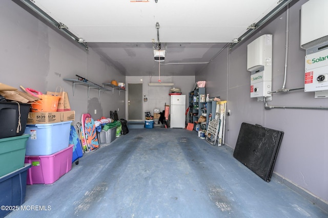 1A Winthrop Pl Unit 55, Whiting, NJ 08759 - garage with a garage door opener and freestanding refrigerator