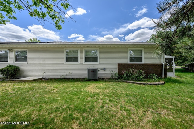1A Winthrop Pl Unit 55, Whiting, NJ 08759 - back of property with cooling unit, a yard, and brick siding