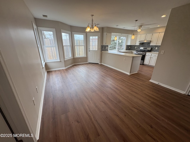 35 Deer Dr S, Barnegat, NJ 08005 - kitchen with stainless steel gas range oven, baseboards, dark wood finished floors, decorative backsplash, and recessed lighting