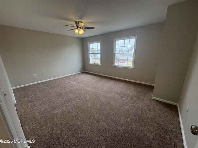 35 Deer Dr S, Barnegat, NJ 08005 - spare room featuring dark colored carpet, a ceiling fan, and baseboards