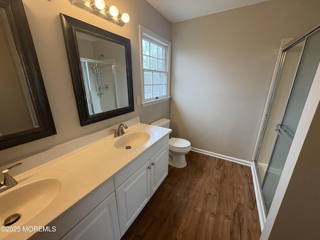 35 Deer Dr S, Barnegat, NJ 08005 - bathroom featuring wood finished floors, a shower stall, toilet, double vanity, and baseboards