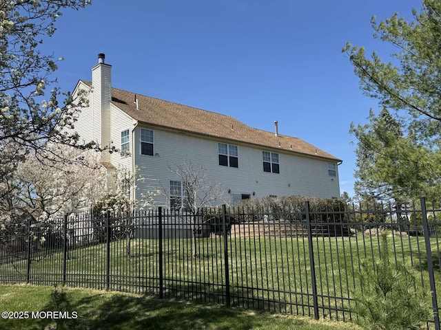 36 Graversham Dr, Marlboro, NJ 07746 - back of property featuring a chimney