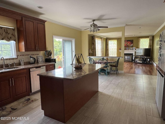 36 Graversham Dr, Marlboro, NJ 07746 - kitchen featuring dishwasher, a sink, a fireplace, a kitchen island, and crown molding