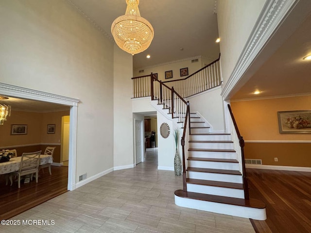36 Graversham Dr, Marlboro, NJ 07746 - stairs with a chandelier, a high ceiling, baseboards, crown molding, and recessed lighting